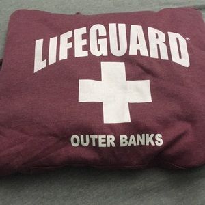 A purple “Lifeguard” hoodie/sweatshirt.